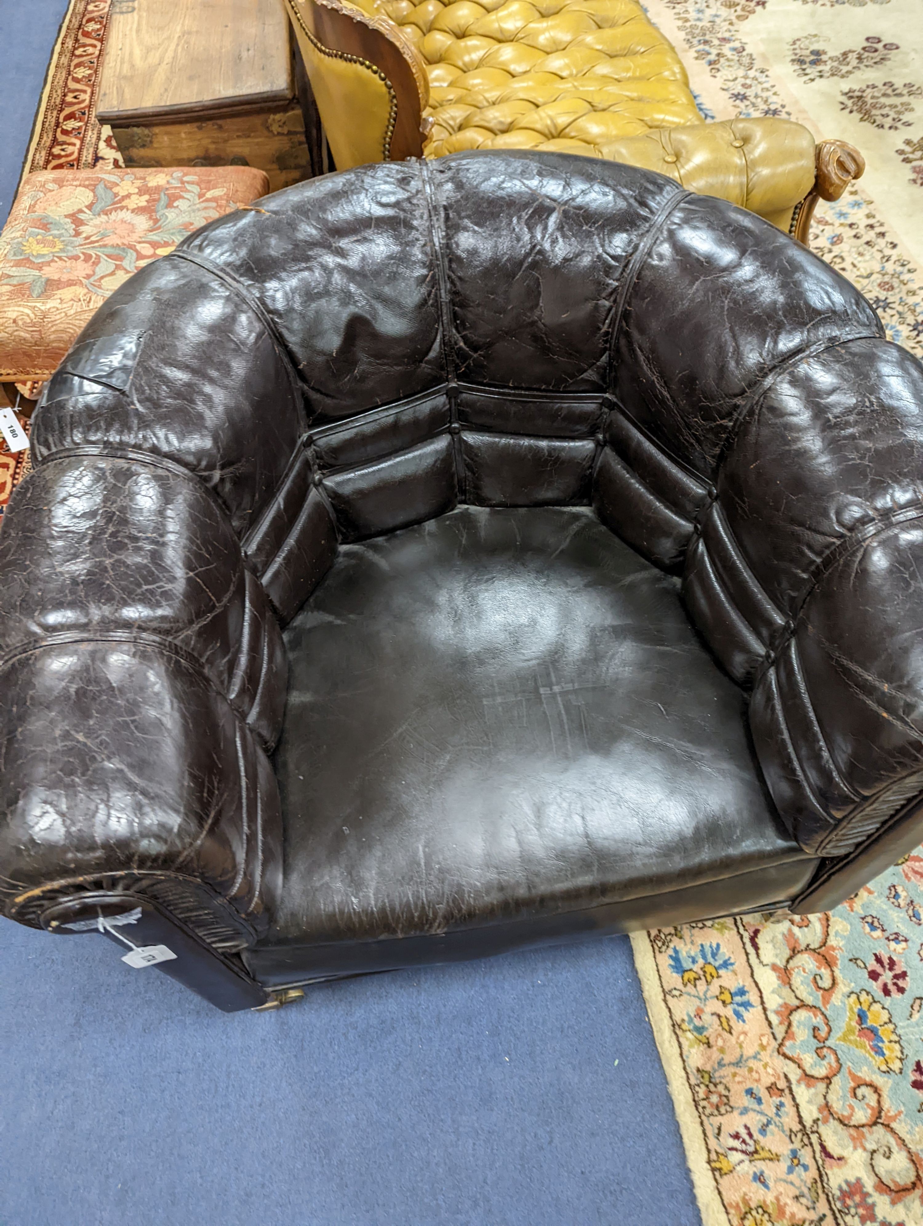 A black leather tub framed club armchair, width 88cm, depth 76cm, height 76cm